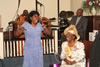 Bonita C. Ruff singing to Mother Evelyn